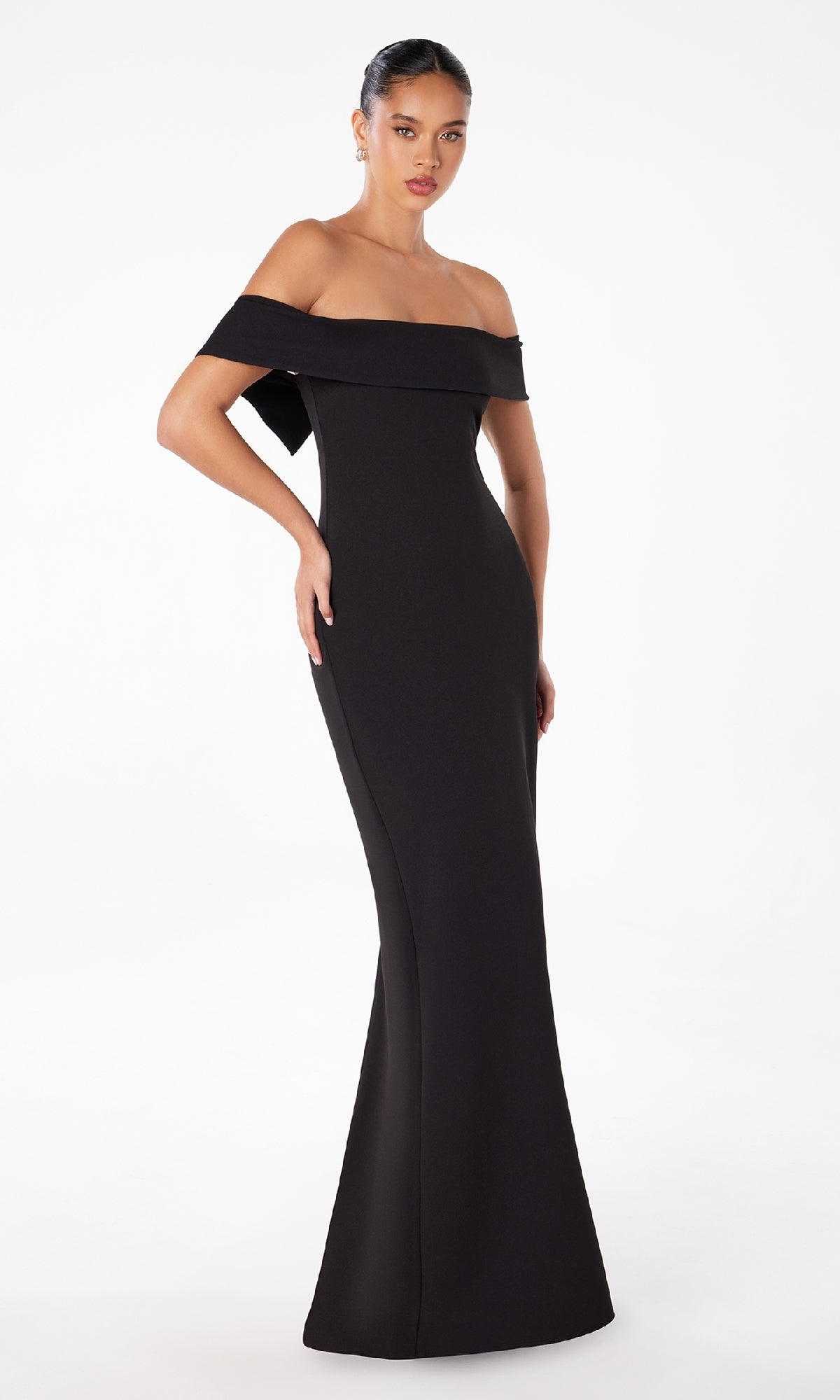 Woman in a black Off-the-Shoulder Long Prom Dress: Astee T2011, featuring a fitted silhouette and flared hem, poses against a plain white background.